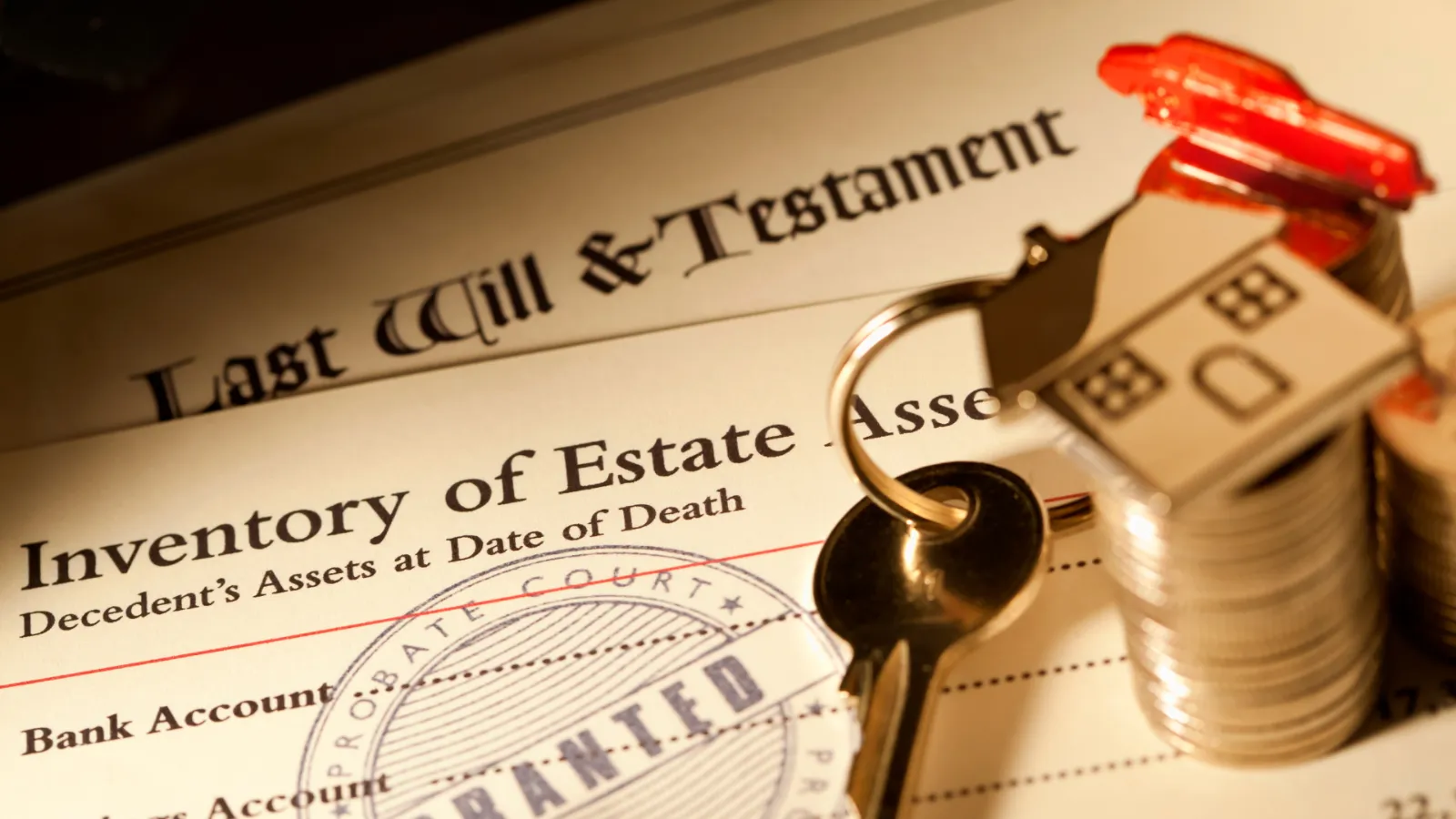 A last will and testament and estate inventory with a probate court stamp, house keys, and a small house figure on a stack of coins